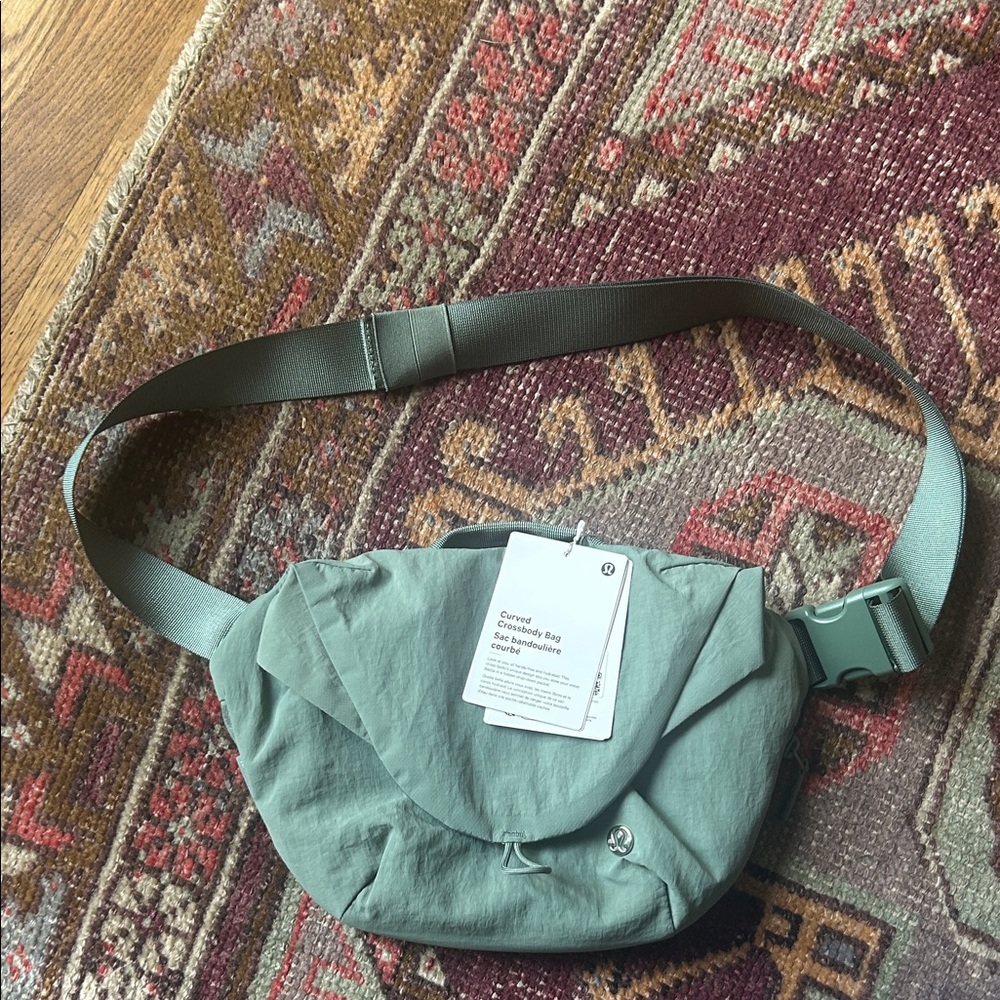 Lululemon curved crossbody bag new with tags , sage green with water bottle hold